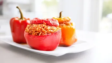 Фото рецепта Фаршированные перцы с тушёнкой в томатном соусе, сытный рецепт на каждый день