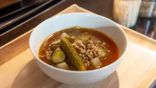 Фото рецепта: Рассольник с говядиной и ячневой крупой: густой суп с яркой огуречной кислинкой