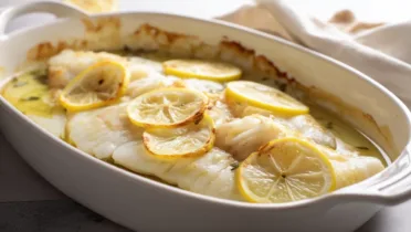 Фото блюда: Нежная рыба в духовке с лимоном и ароматным маслом