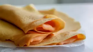 Фото рецепта: Блинчики с цукатами и мягкой апельсиновой начинкой